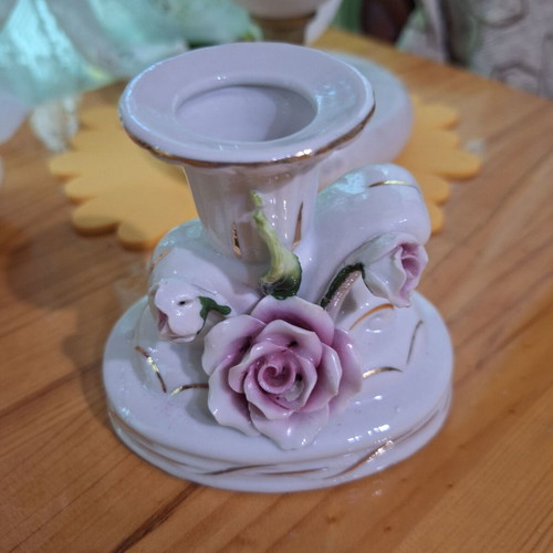 Porcelain candlestick with gilded elements like new
