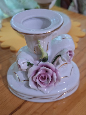 Porcelain candlestick with gilded elements like new