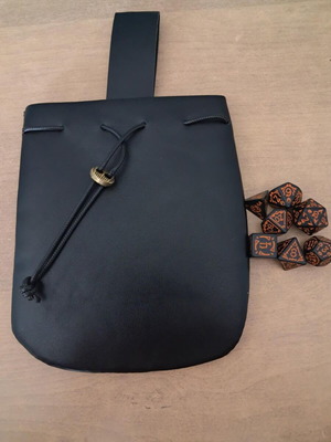 Big black faux-leather dice bag with black spooky D&D dice set