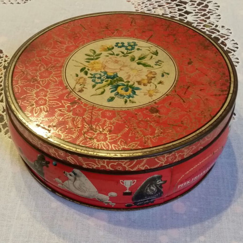 Vintage tin box used with floral and dog motifs