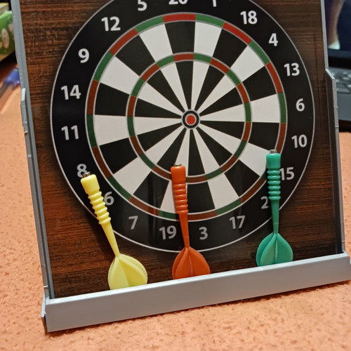 Tabletop dartboard unused with 3 darts
