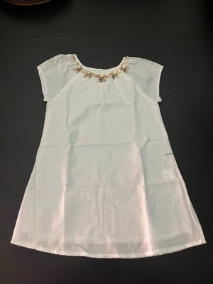 White blouse with gold details
