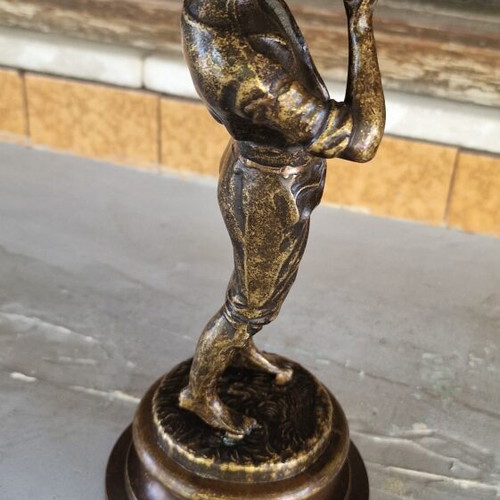 Vintage bronze sculpture of a boy playing flute used