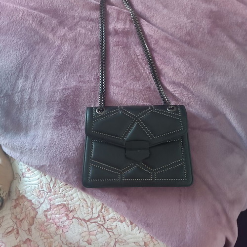 Shoulder bag like new with gray studs and chain, black