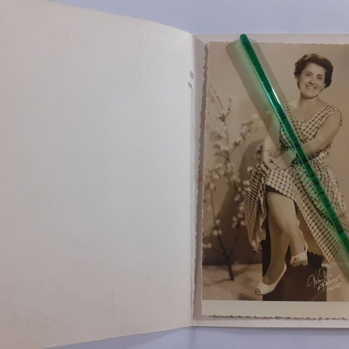 Two identical vintage photos of a woman in a photo studio, pack