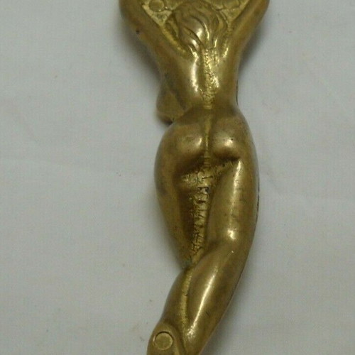 Vintage solid brass bottle opener shaped like a woman used