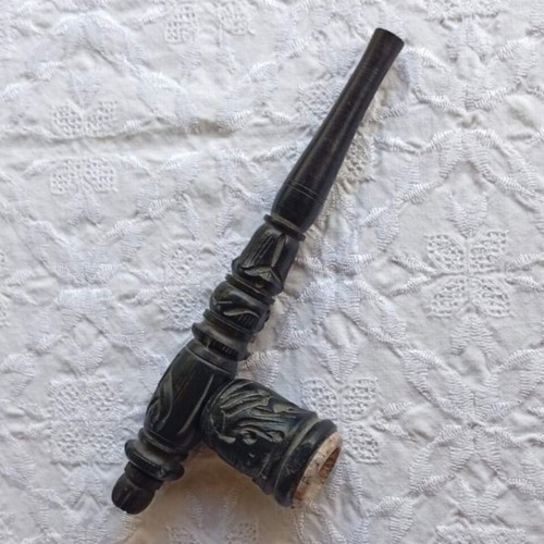 Handmade carved wooden pipe with stone inlay
