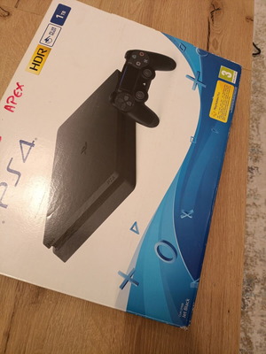 PlayStation 4 Slim 1TB like new with DualShock controller