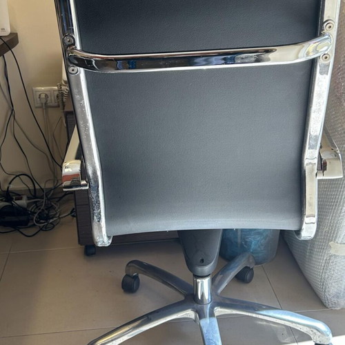 Neoset executive office chair used with ribbed black leather and chrome frame