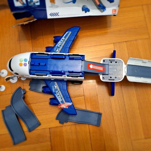 Airplane toy used with lights and sounds, transforms into station