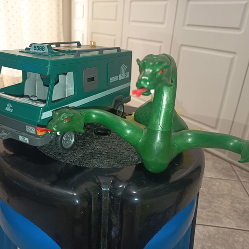Playmobil car and dragon used with many damages