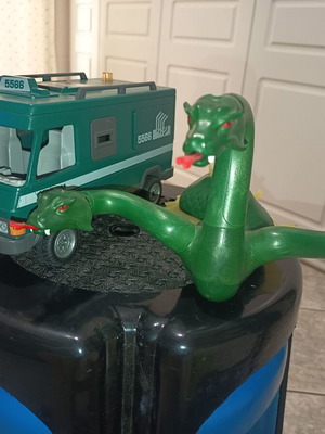 Playmobil car and dragon used with many damages