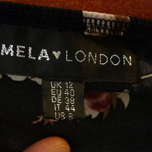 MELA LONDON floral print black jumpsuit medium used