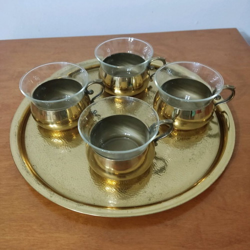 Bronze tea cups with glass on tray used