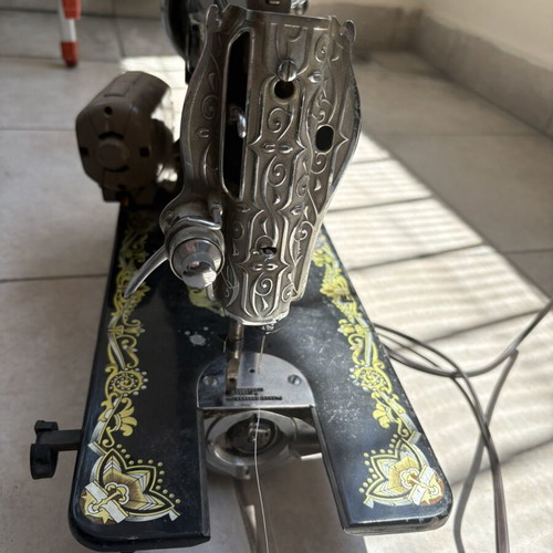 Vintage Eastern sewing machine used with gold Egyptian designs