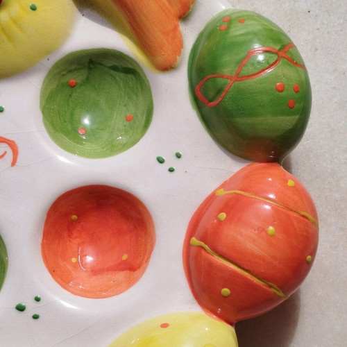 Chicken egg holder with colorful eggs in porcelain new for festive table