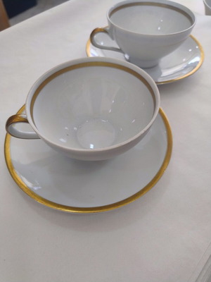 Porcelain tea cup set used, two cups with saucers