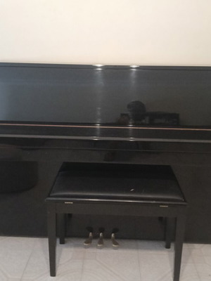 Eterna Yamaha upright piano like new with storage bench