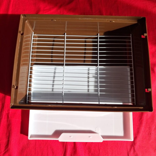 Hamster cage like new with two doors, house, feeder, and water bottle
