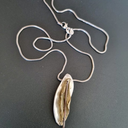 Silver handmade jewelry used with mixed materials leaf design