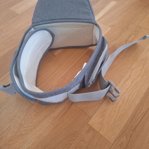 Gabesy ergonomic hip seat carrier used with branded baby toys