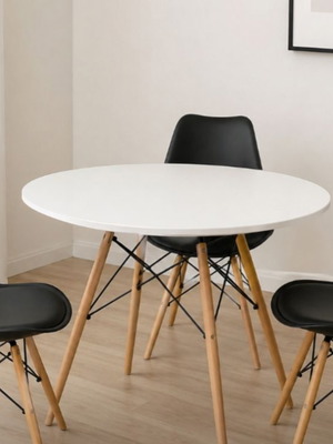Dining set with white table and three black chairs