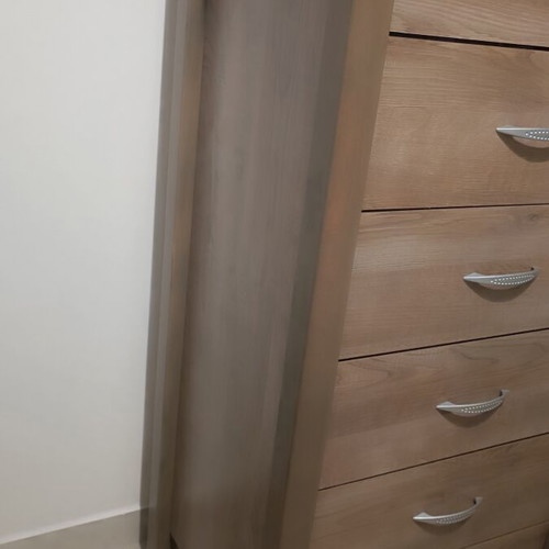 Wooden bedroom set with semi-double bed, nightstand, and chest of drawers