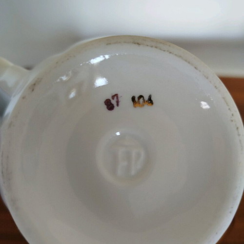 Porcelain teapot vintage with gold details used
