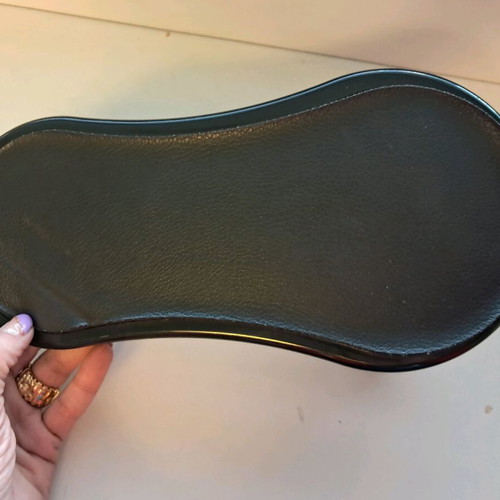 Office armrest base used, black plastic