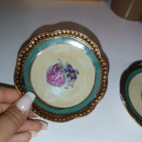 Vintage porcelain plates set of 4 with romantic design and gold trim used