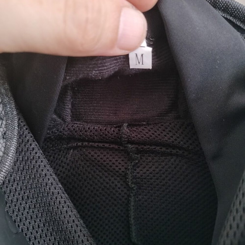 Perforated motorcycle jacket like new with plastic protections, medium size
