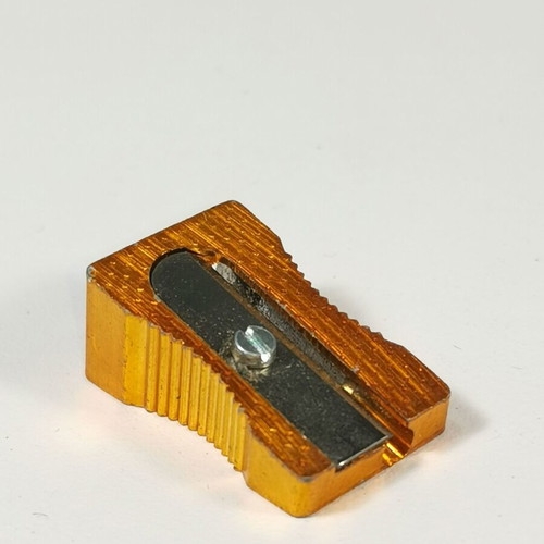 Vintage metal pencil sharpener used, orange gold, Made in Germany