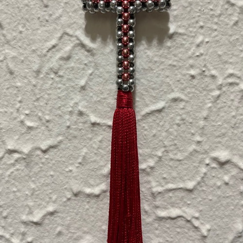Decorative cross with beads and red tassel like new