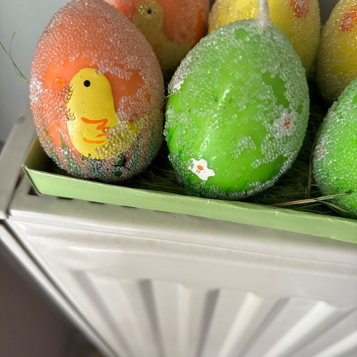 Easter candles shaped like eggs like new, painted