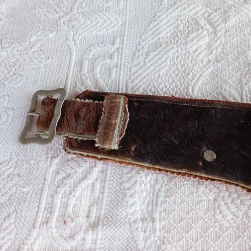 Vintage leather belt with cartridge and pistol holster used