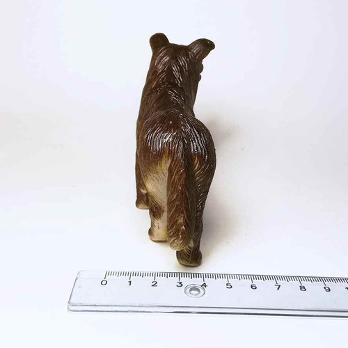 Dog plastic figure used with scratches and marks