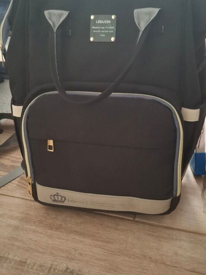 Lequeen Backpack Diaper Bag Black like new with changing mat and bottle warmer