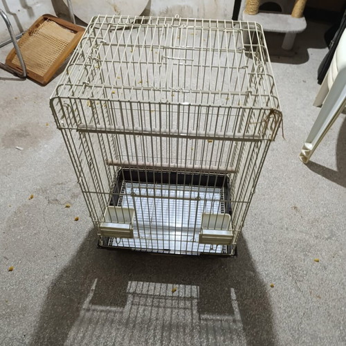 Large metal bird cage like new, with wooden perches and feeders