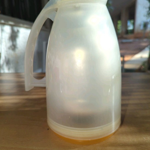 Household thermos like new, milky plastic with orange, glass interior