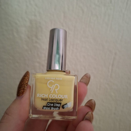 Nail polish butter yellow used, over 70% full