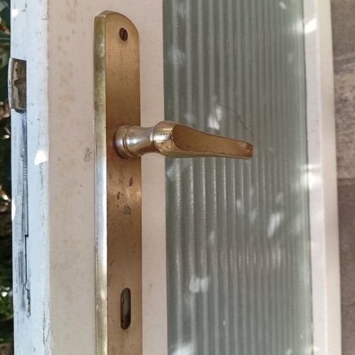 Interior wooden door with glass and gold handle