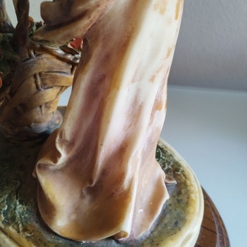 Vintage Italian decorative statue of a girl with roses, used