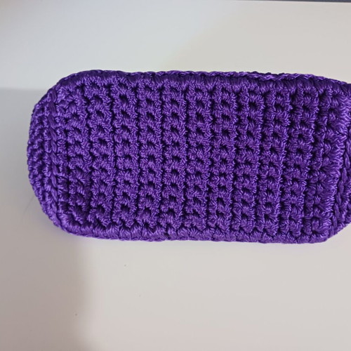 Knitted clutch bag like new, purple with gold details