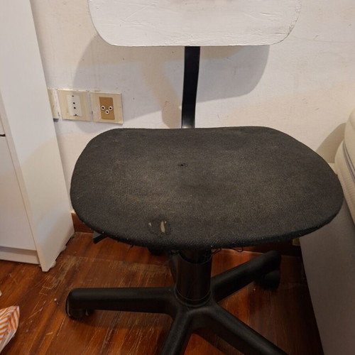 IKEA office chair used with slightly torn fabric and missing head cushion