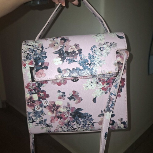 Handbag like new, pink with floral pattern, multiple pockets and strap
