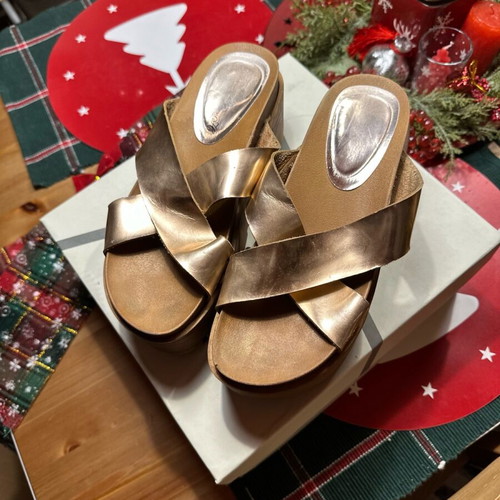 Gold flatforms used with thick treaded sole and wide straps