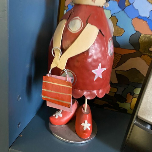 Decorative metal doll with spring like new