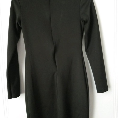 Black dress size M with open neckline, unused