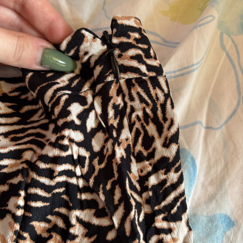 Leopard skirt like new with front button details, size XS