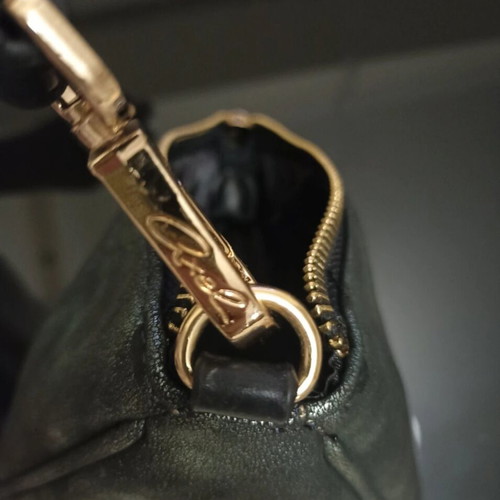 Axel triangle bag like new, dark green with gold details
